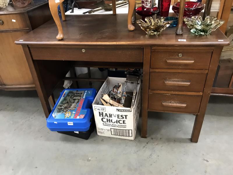 A 1950's oak single pedestal office desk