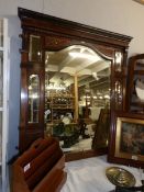 A mahogany over mantel mirror.