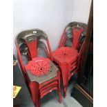 A set of 8 French attributed red metal stacking chairs