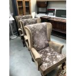 2 brown fabric wing arm chairs with Queen Anne legs