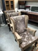 2 brown fabric wing arm chairs with Queen Anne legs