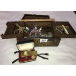 A box of costume jewellery including rings, watches etc.