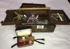 A box of costume jewellery including rings, watches etc.