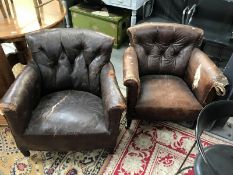 A Victorian Howard & Sons leather arm chair marked on rear leg and castors,