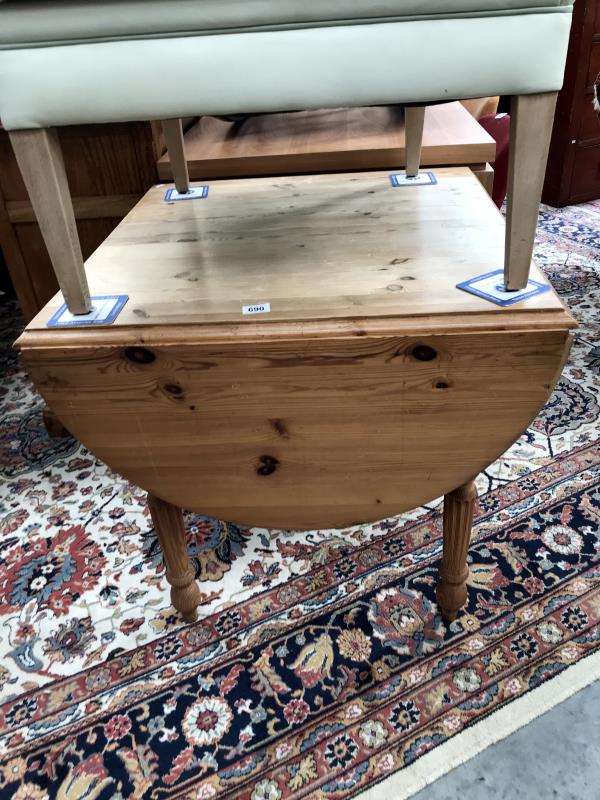 A pine drop leaf kitchen table