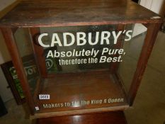A display cabinet advertising Cadbury's.