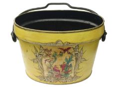 An old yellow painted bucket with oriental scene.