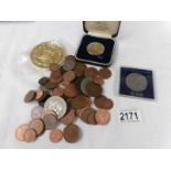 A mixed lot of coins including George III penny and 42 grams of pre 1947 silver coins.