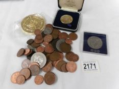 A mixed lot of coins including George III penny and 42 grams of pre 1947 silver coins.
