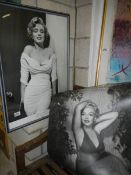 A framed and glazed picture of Marilyn Monroe and Marilyn Monroe posters.