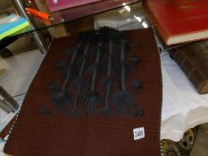 A Mantenga craft Swazi wall hanging of plaited hair designs for women.