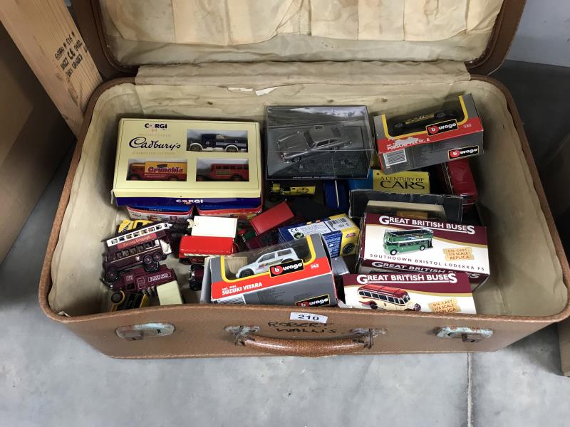 A suitcase containing Diecast boxed and unboxed cars including Corgi, Burago etc.