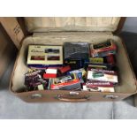 A suitcase containing Diecast boxed and unboxed cars including Corgi, Burago etc.