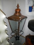 An old copper street lamp top.