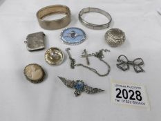 A collection of silver and white metal jewellery including vesta case, bangles, R.A.