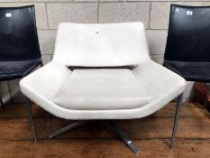 A B & B Italia Metropolitan cream leather arm chair by Jeffrey Bernett.