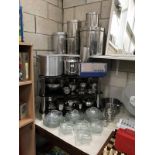 A large quantity of catering stainless steel pans etc plus glass tea cups and saucers