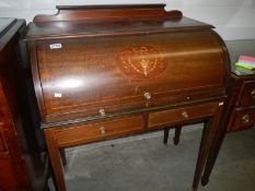 A mahogany inlaid ladies bureau.