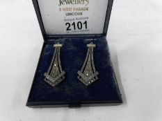 A pair of silver marcasite pendant earrings.