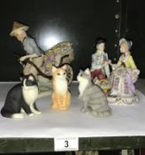 A collection of figurines and cat models including a man with Rickshaw & courting couple