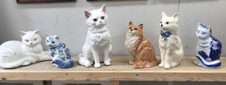 A good lot of porcelain cat figures