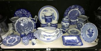 A shelf of blue and white pottery