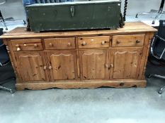 A solid pine dresser base / kitchen wall unit