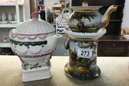 A handpainted small teapot on stand and one other teapot designed to look on plinth