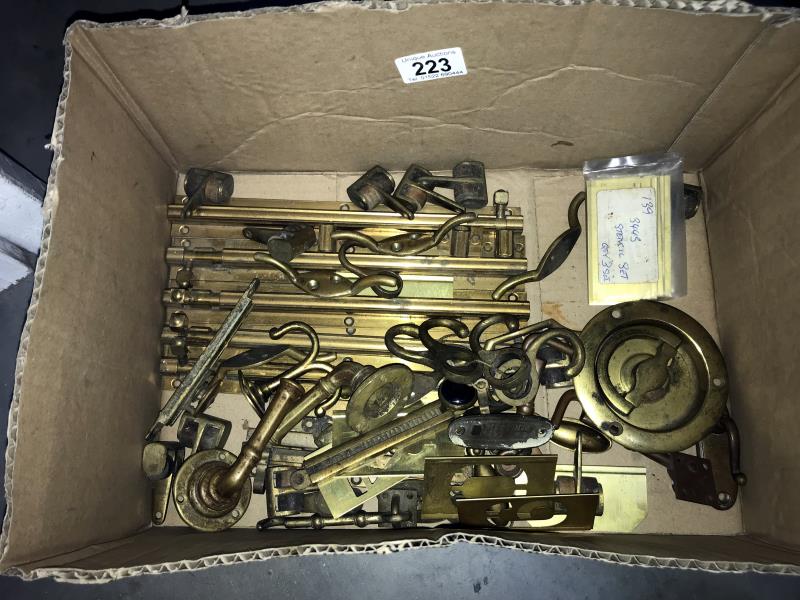 A box containing brass catches etc.