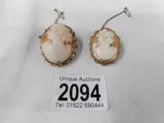 2 shell cameo brooches of female profiles in 9ct gold mounts with safety chains.