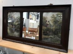 An Edwardian cryptic mirror with pictures either side