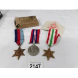 A set of 3 WW2 medals (Italy Star, 1939-45 Star and War medal) with original O.H.M.