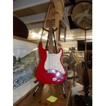 A Squire Strat by Fender electric guitar, (neck straight,