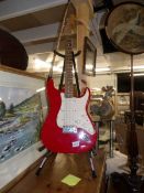 A Squire Strat by Fender electric guitar, (neck straight,