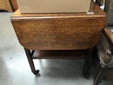 An oak drop leaf tea trolley