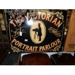 A painted sign "Victorian Portrait Parlour".