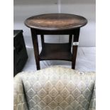 A small 1930's round oak side table