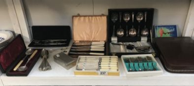 A mixed lot including cased cutlery, cased travelling wash set,