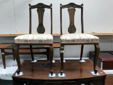 A pair of Edwardian mahogany hall chairs