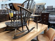 A dark oak rocking chair possibly Ercol and a kitchen chair