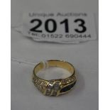 An 18ct gold ring set sapphires and diamonds, marked 750 18k, approximately 6 grams, size P.