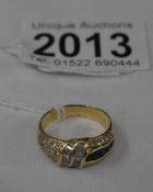 An 18ct gold ring set sapphires and diamonds, marked 750 18k, approximately 6 grams, size P.