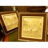 A pair of framed medieval scene wall plaques.
