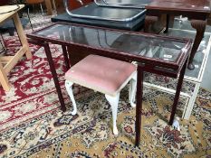 A glass topped darkwood stained hall/wall table with gold string inlay