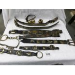 A quantity of horse leathers with brass fittings together with horse bells.