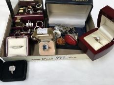 A collection of costume jewellery including rings and brooches