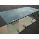 A 'Flam' Italian glass table with V shaped legs.