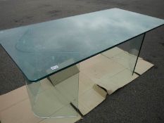A 'Flam' Italian glass table with V shaped legs.