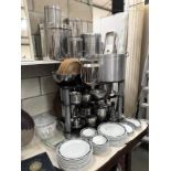 A large quantity of catering stainless steel pans and Churchill hotel ware plates