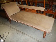 A mahogany chaise longue.